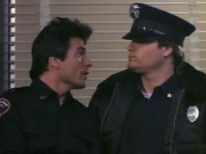 Big hair vs. big hat.